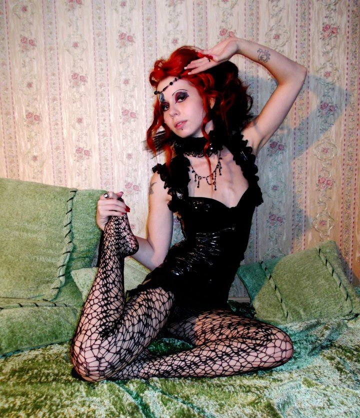 Redhead Gothic Girl wearing Black Fishnet Pantyhose and Black Bodysuit